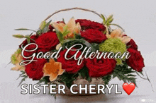 a bouquet of flowers in a basket with the words `` good afternoon sister cheryl '' written on it .