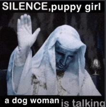 a dog woman is talking to a statue in a silence puppy girl meme