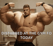 a picture of a very muscular man with the words disturbed at the gym fo today