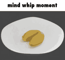 a fortune cookie sits on a white plate with the words mind whip moment below it