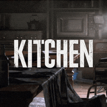 a dark kitchen with the word kitchen written in white letters