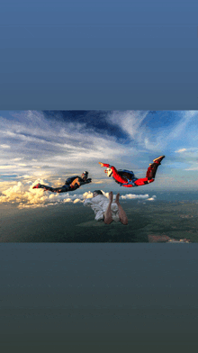 a person in a white shirt is flying through the air with two other people