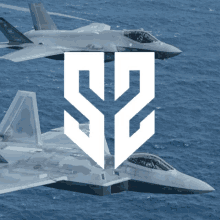 two fighter jets are flying over the ocean with the letter s on the bottom right