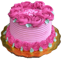 a cake with pink frosting and green sprinkles