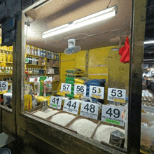 a display of various types of rice including premium grade well milled rice