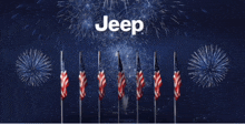 a jeep fireworks display with american flags in front of it