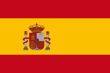 a yellow and red flag with a coat of arms and a crown