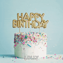 a cake with sprinkles and a topper that says happy birthday