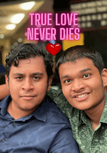 two men posing for a picture with the words true love never dies