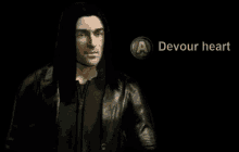 a man in a leather jacket is standing in front of a button that says devour heart