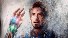 a painting of tony stark with the infinity gauntlet on