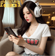 a woman wearing headphones and a white shirt that says sot