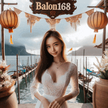 a woman in a white lace dress stands in front of a sign that says balon168