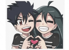 a boy and a girl making a heart with their hands