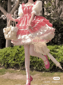 a girl in a pink and white dress is holding an umbrella and a basket of flowers