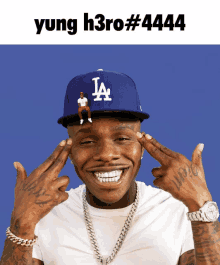 yung h3ro # 4444 is written above a man wearing a la baseball cap