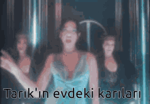 a blurred image of a woman with the words tarik 'in evdeki karlari