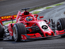 a red race car has azero written on the side