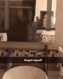 a bathroom with a sink and a mirror that says forgot myself on it