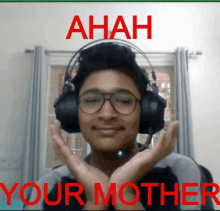 a young man wearing headphones and glasses says " ahah your mother " in red