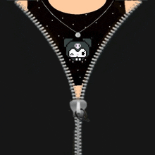 a close up of a zipper on a black shirt with a skull on it .