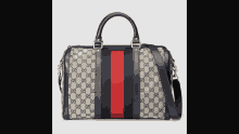 a gucci bag with a red stripe on the side