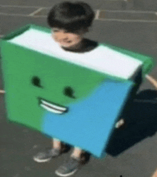 a young boy is wearing a costume of a book with a face on it .