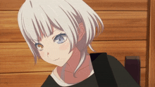 a girl with white hair and blue eyes looks angry