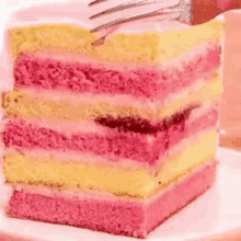 a close up of a slice of cake with a fork on a plate .