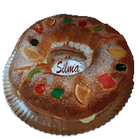 a cake with the name silma on it is on a paper plate