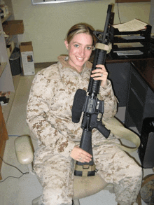 a woman in a military uniform is holding a rifle