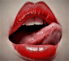 a close up of a woman 's lips with red lipstick