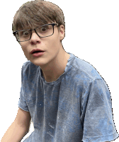 a young boy wearing glasses and a blue shirt