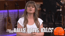 a woman says balls balls balls in front of a basketball on the kelly clarkson show