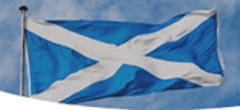 a blue and white scottish flag is flying in the wind