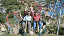 a group of people are riding a roller coaster at a park with the word park written on the bottom