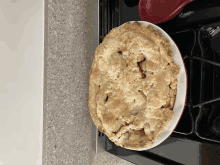 an apple pie sitting on top of a stove top oven