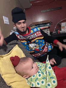 a man wearing a sweater that says ' hamburger ' on it