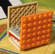 a close up of a stack of lego bricks on a table