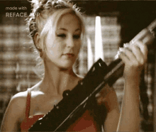 a woman in a red dress is holding a gun with the words made with reface app on the bottom