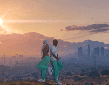 a man and a woman are standing back to back in front of a city skyline at sunset