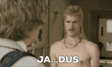 a shirtless man with a mullet and a mustache is talking to another shirtless man .