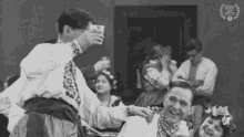 a black and white photo of a group of people with a laurel wreath that says atlanta international film festival