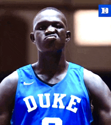 a duke basketball player wears a blue jersey