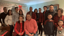 a group of people posing for a picture in a living room