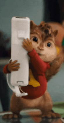 alvin the chipmunk is holding a wii controller in his hands