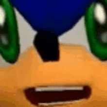 a close up of sonic the hedgehog 's face with green eyes and a smile .