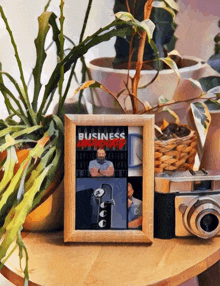 a framed picture of a man with the word business on the top