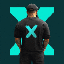 a man wearing a black shirt with a blue x on it