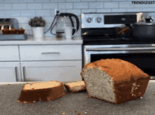 a loaf of bread sits on a counter in front of a stove with the words trendizisst written on the bottom